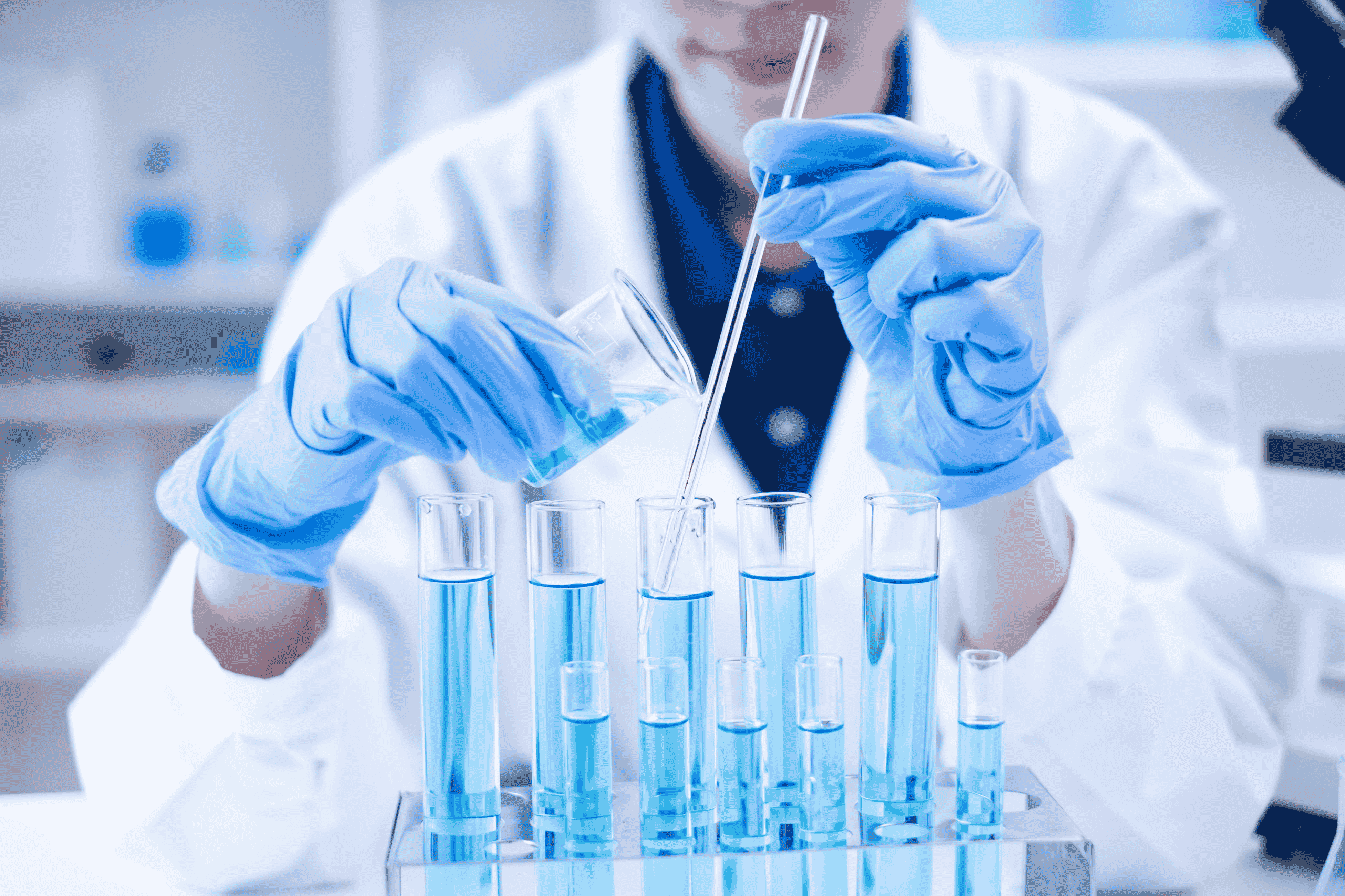 lab scientist with pipettes