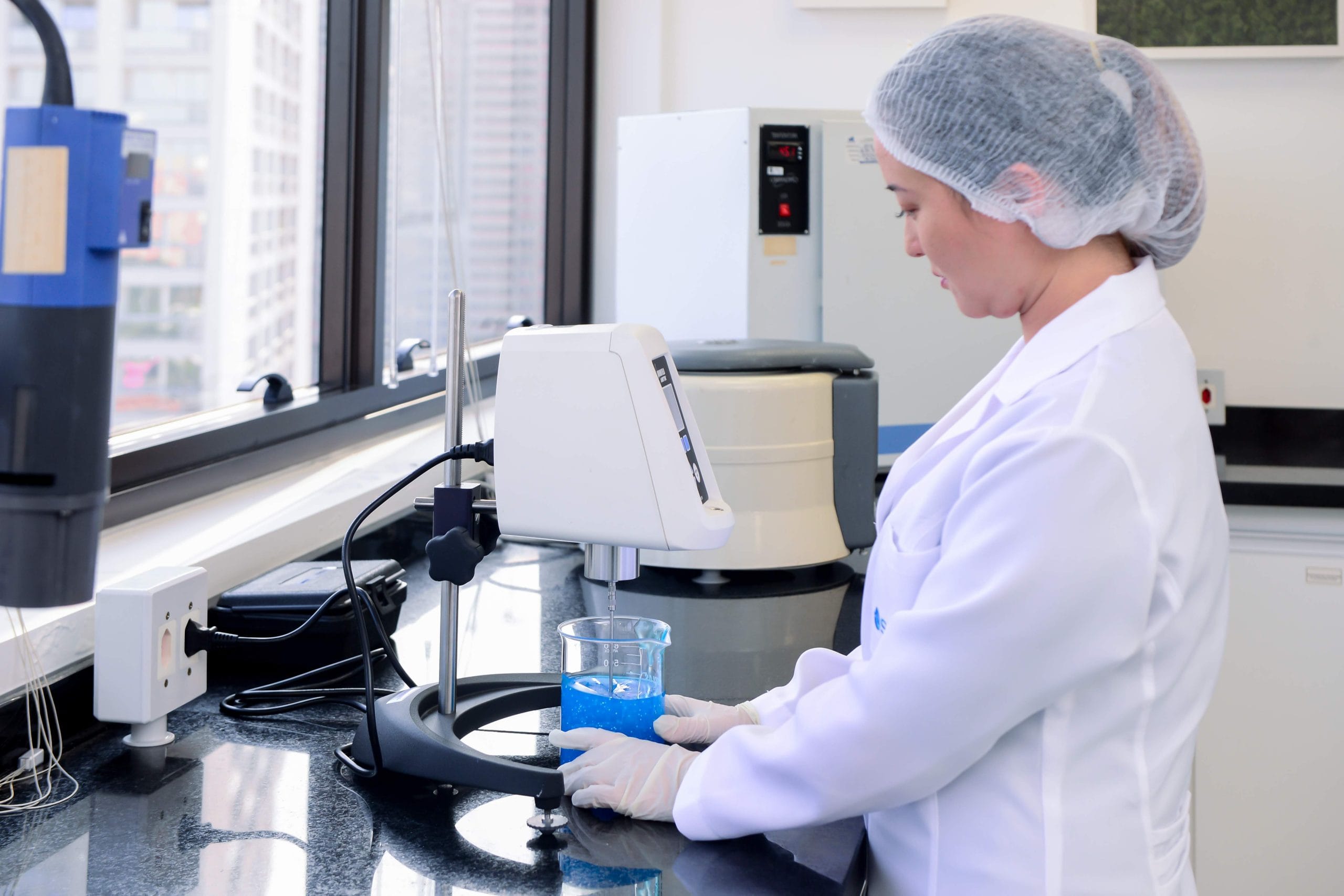 lab person working with a machine