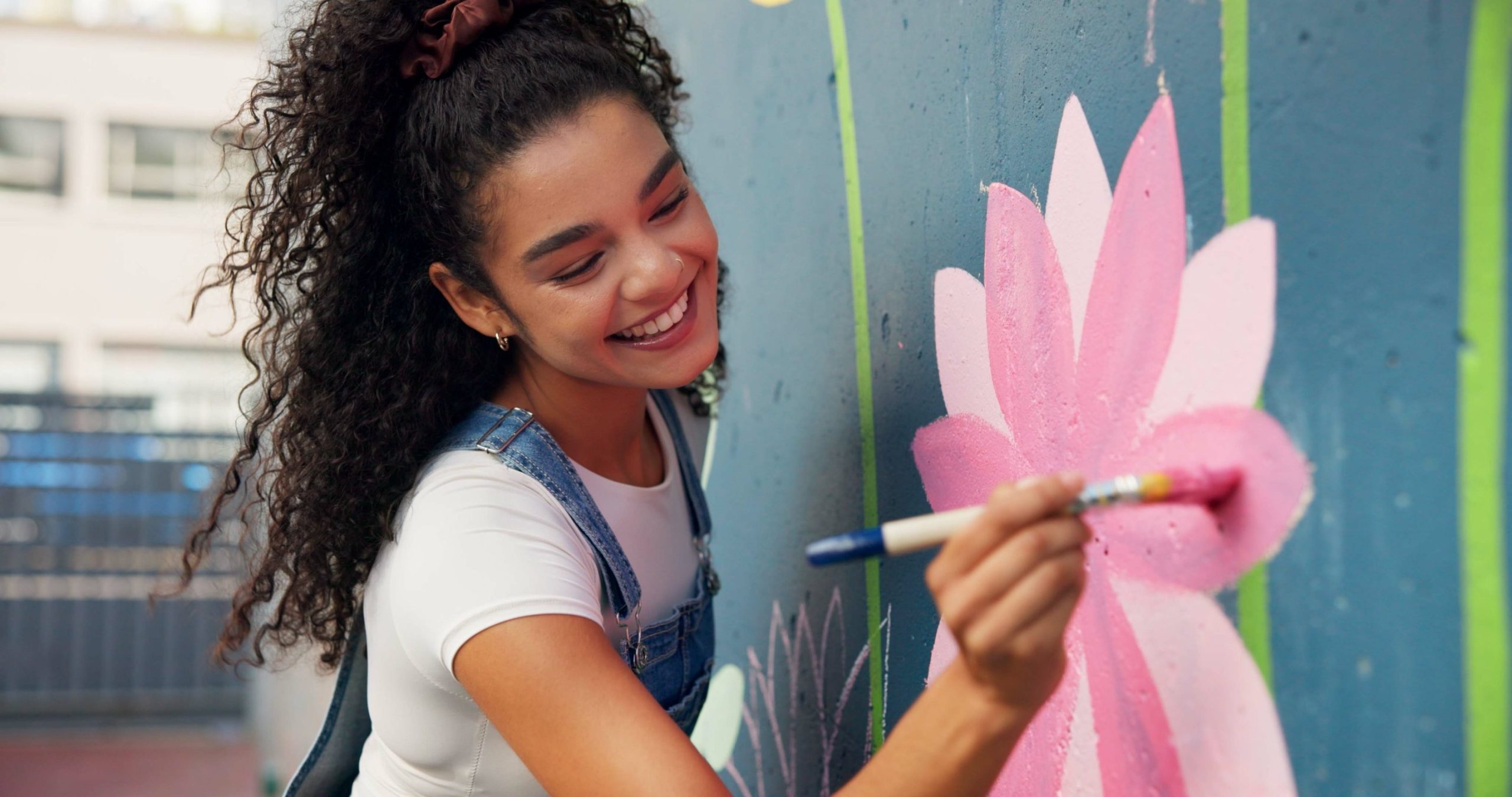 girl painting the wall