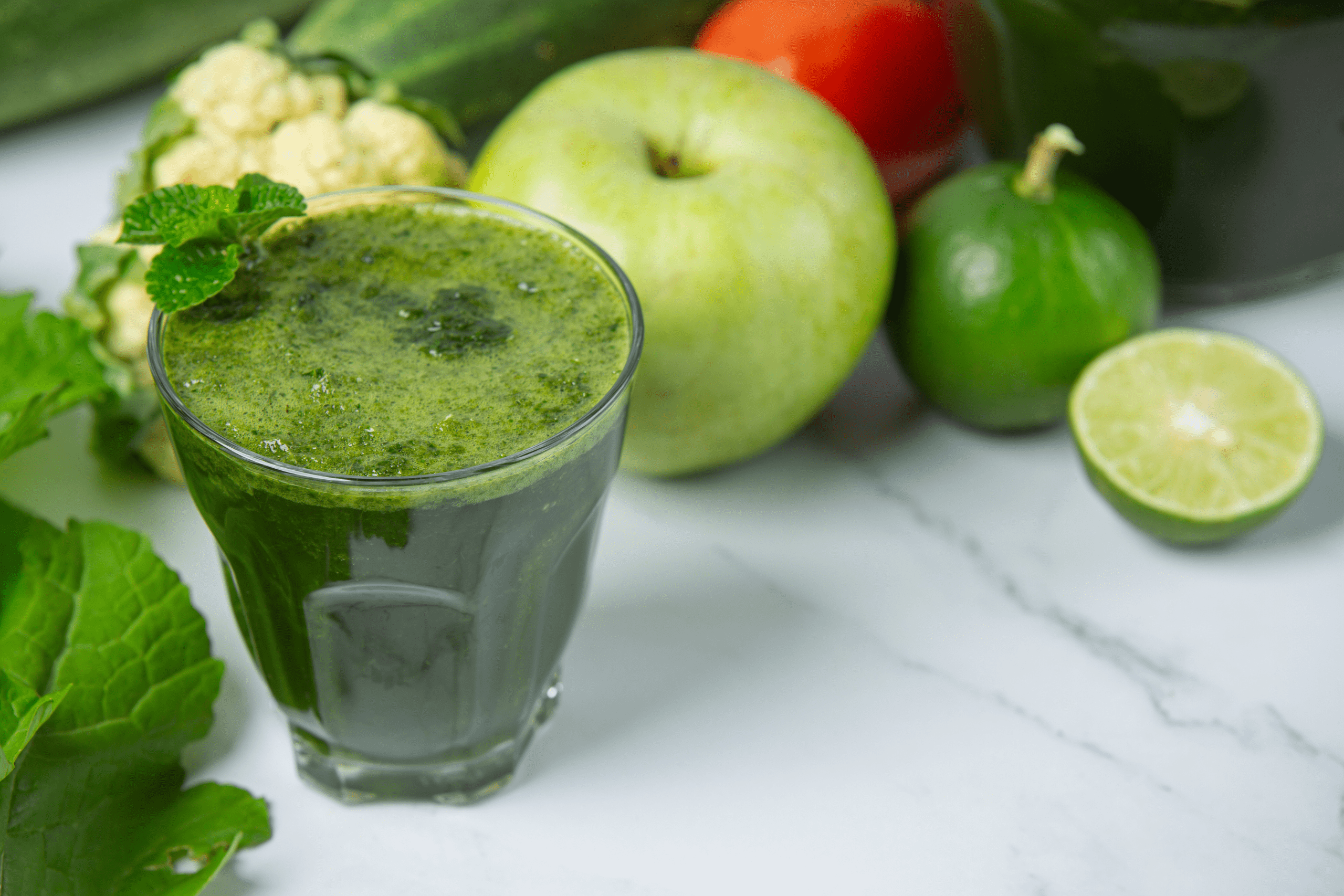 green smoothie among other fruits and plants