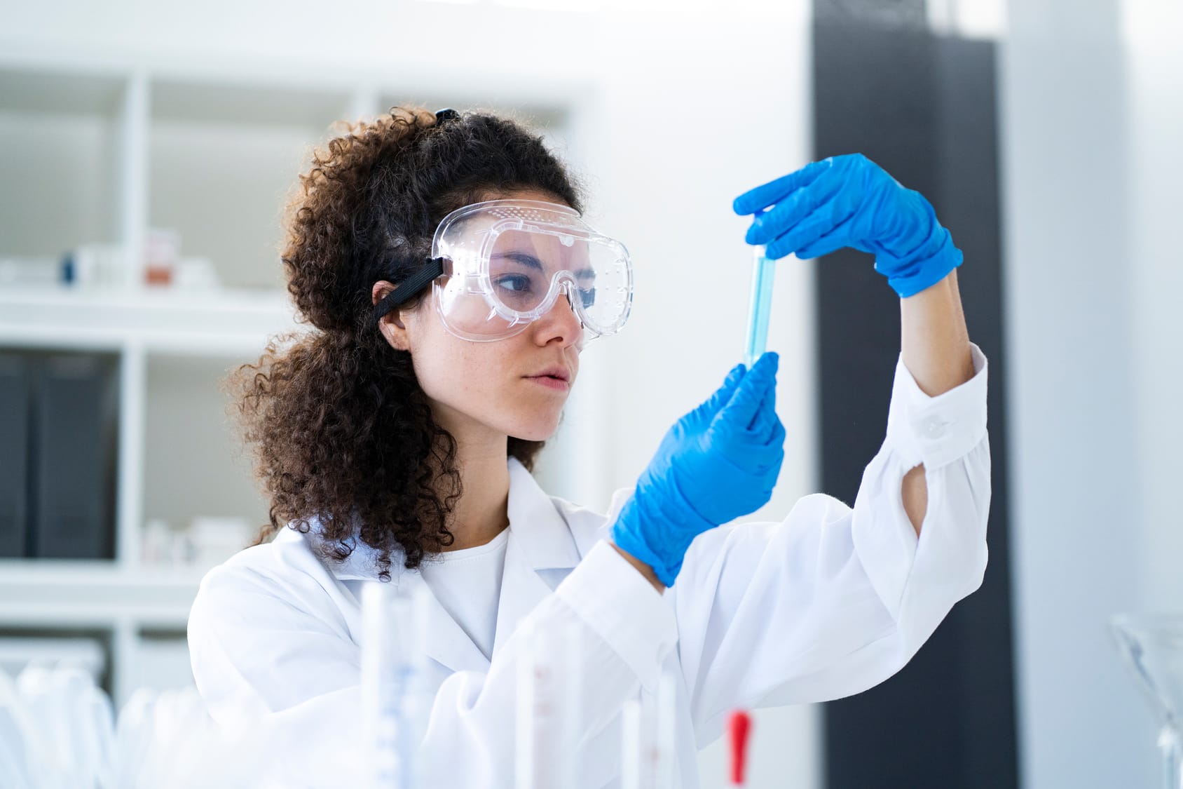 Woman working in a chemistry lab, experimenting, testing, vaccine