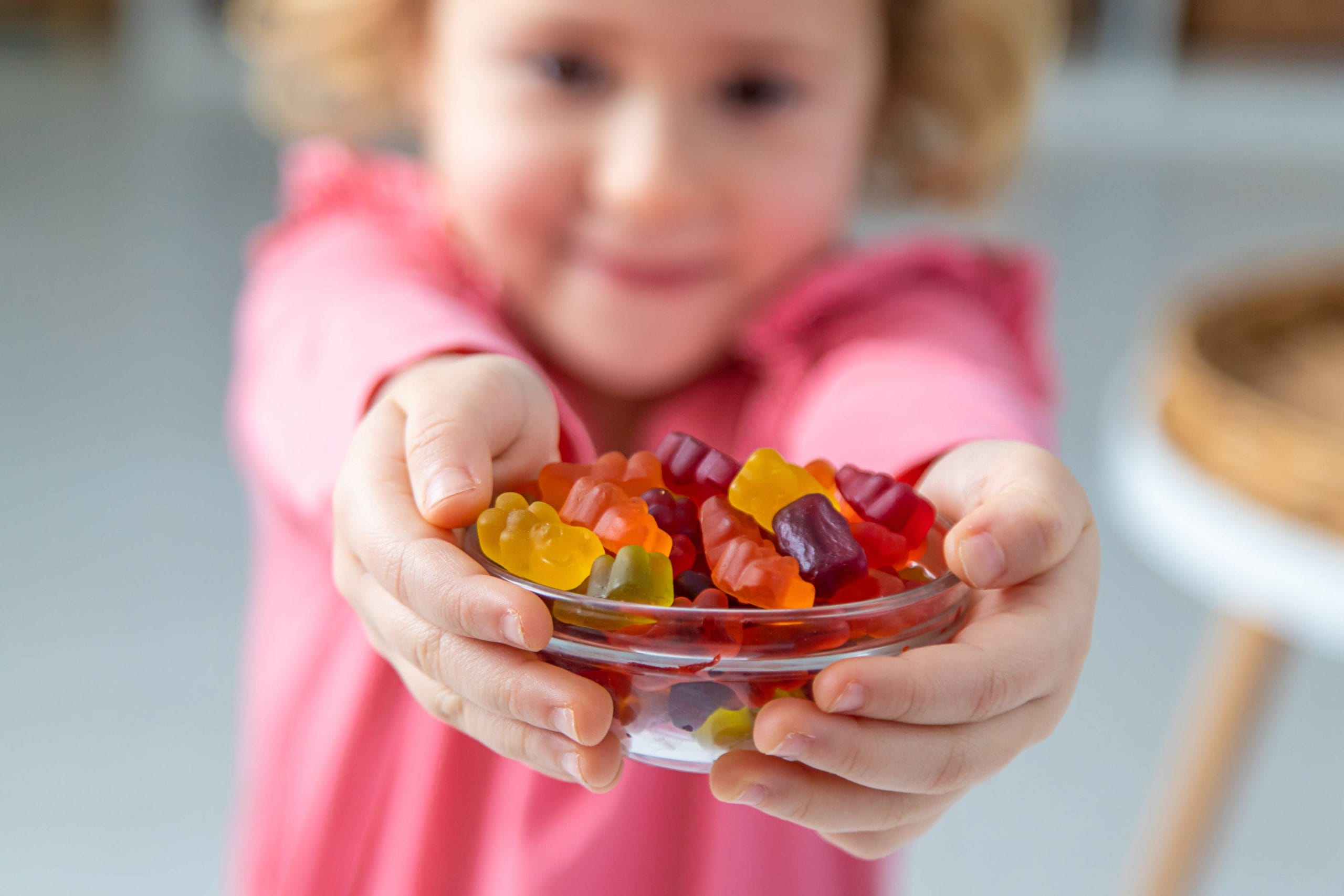 gummies kid holding a plate.