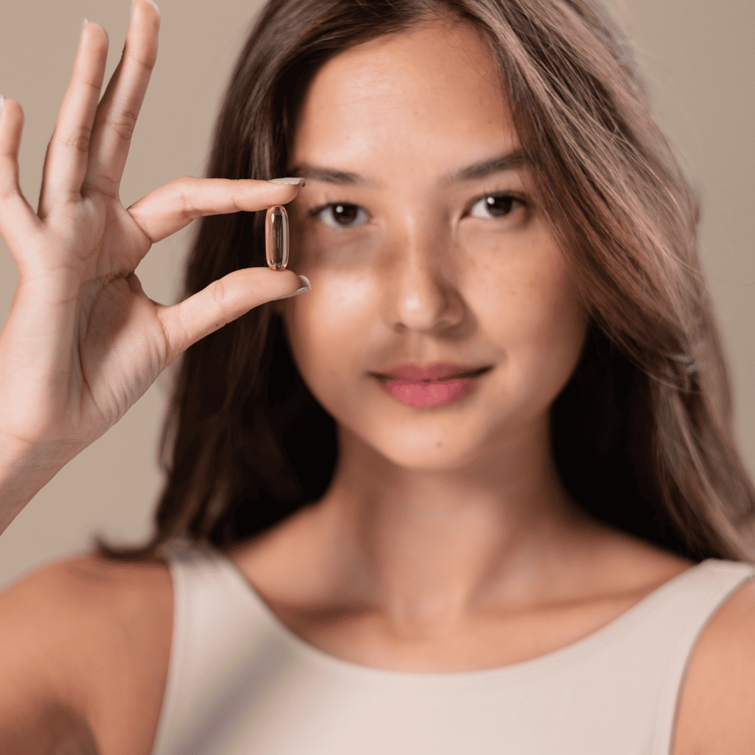 woman holding a veggie softgel