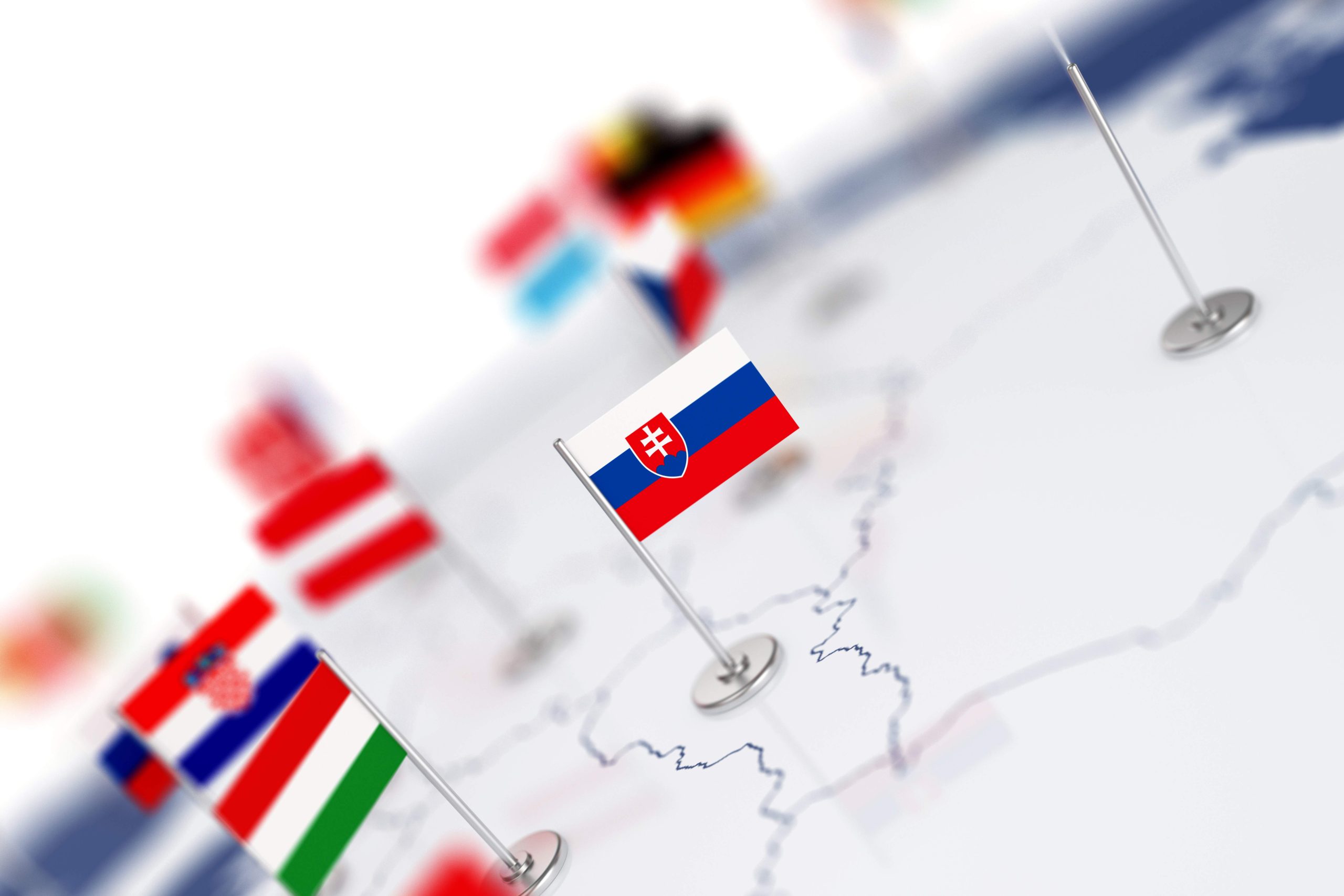 Slovakia flag in the focus. Europe map with countries flags. Shallow depth of field 3d illustration rendering isolated on white background