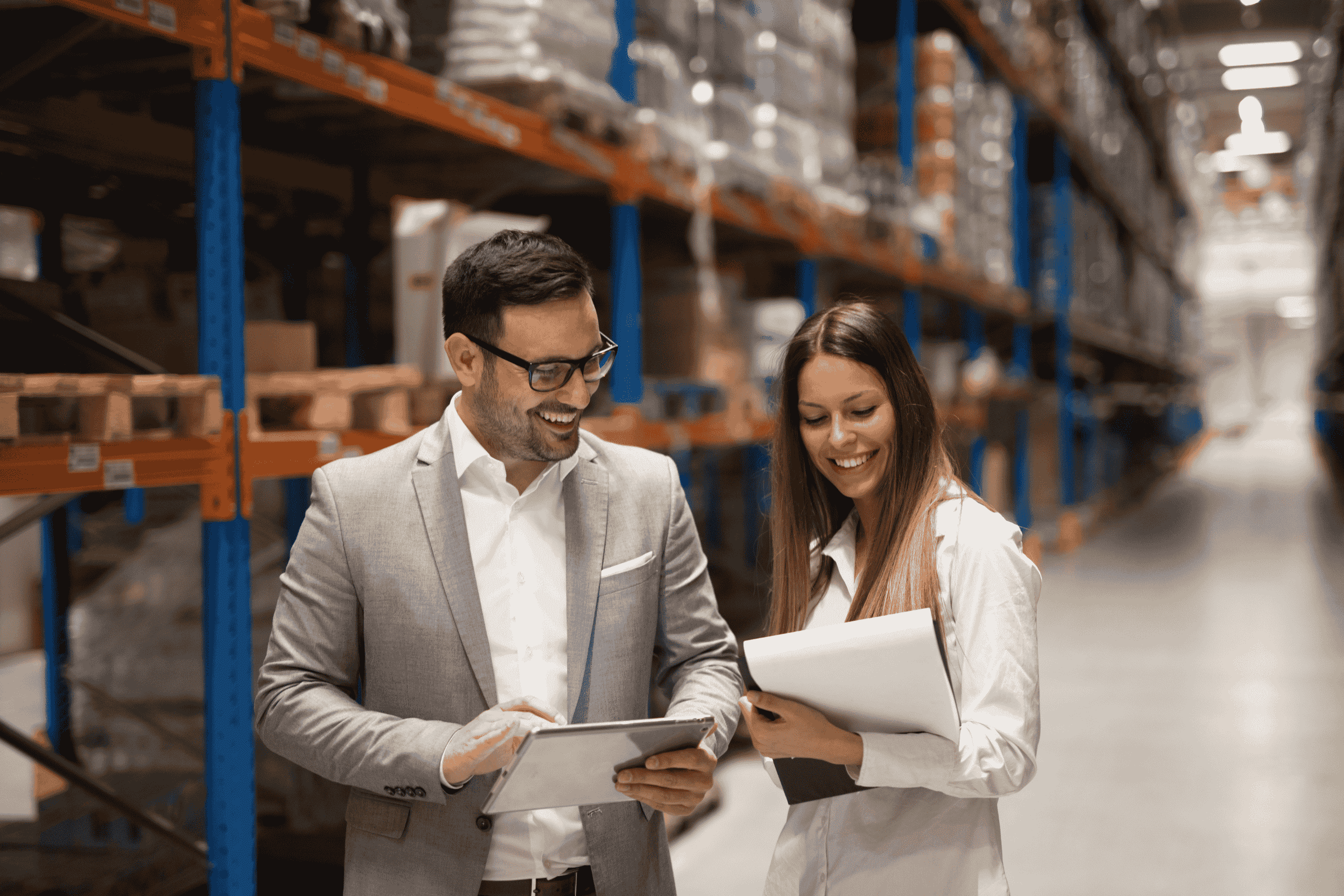 a man and a woman in a warehouse