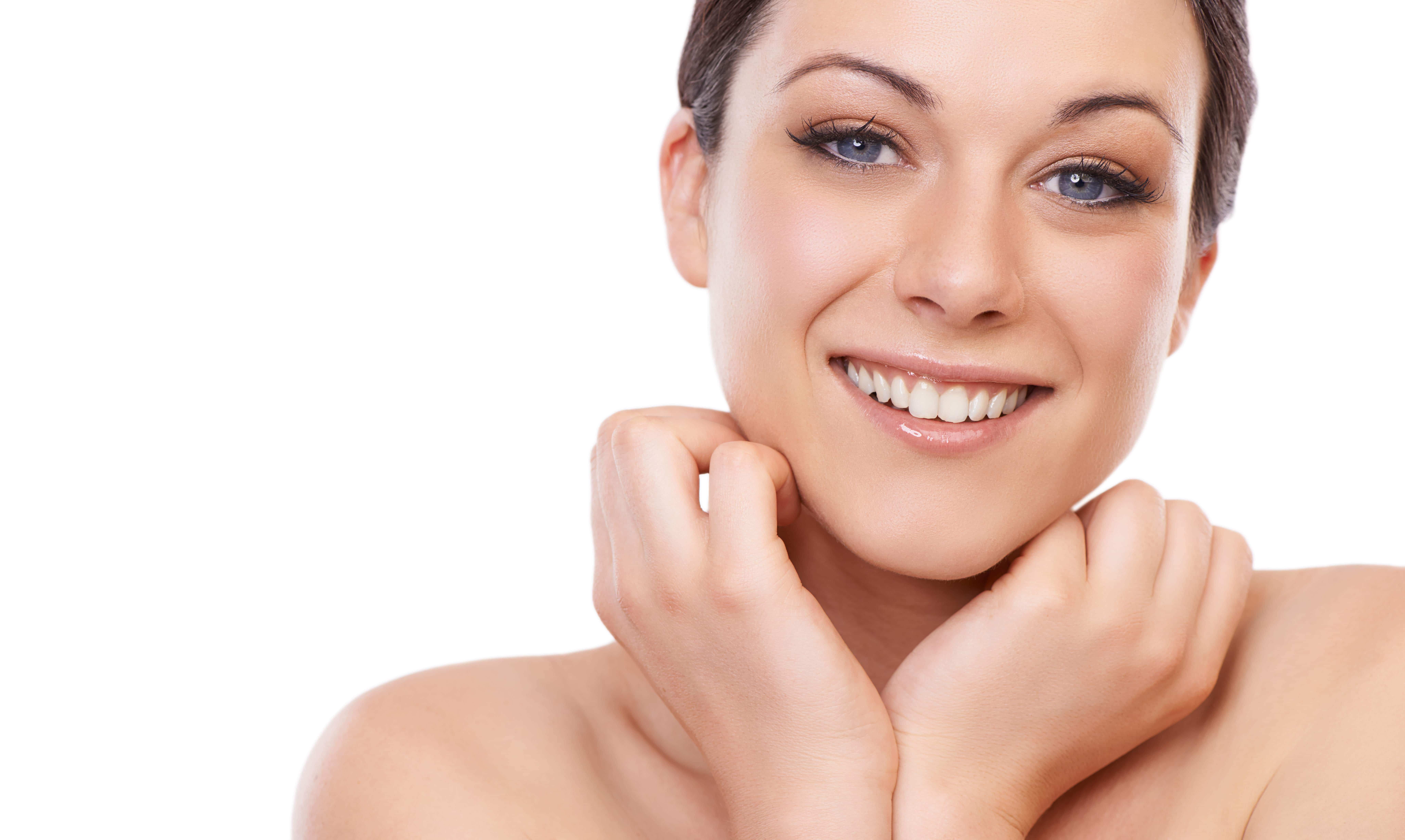 Woman with radiant, healthy-looking skin reflecting natural light, illustrating the glass skin skincare trend.