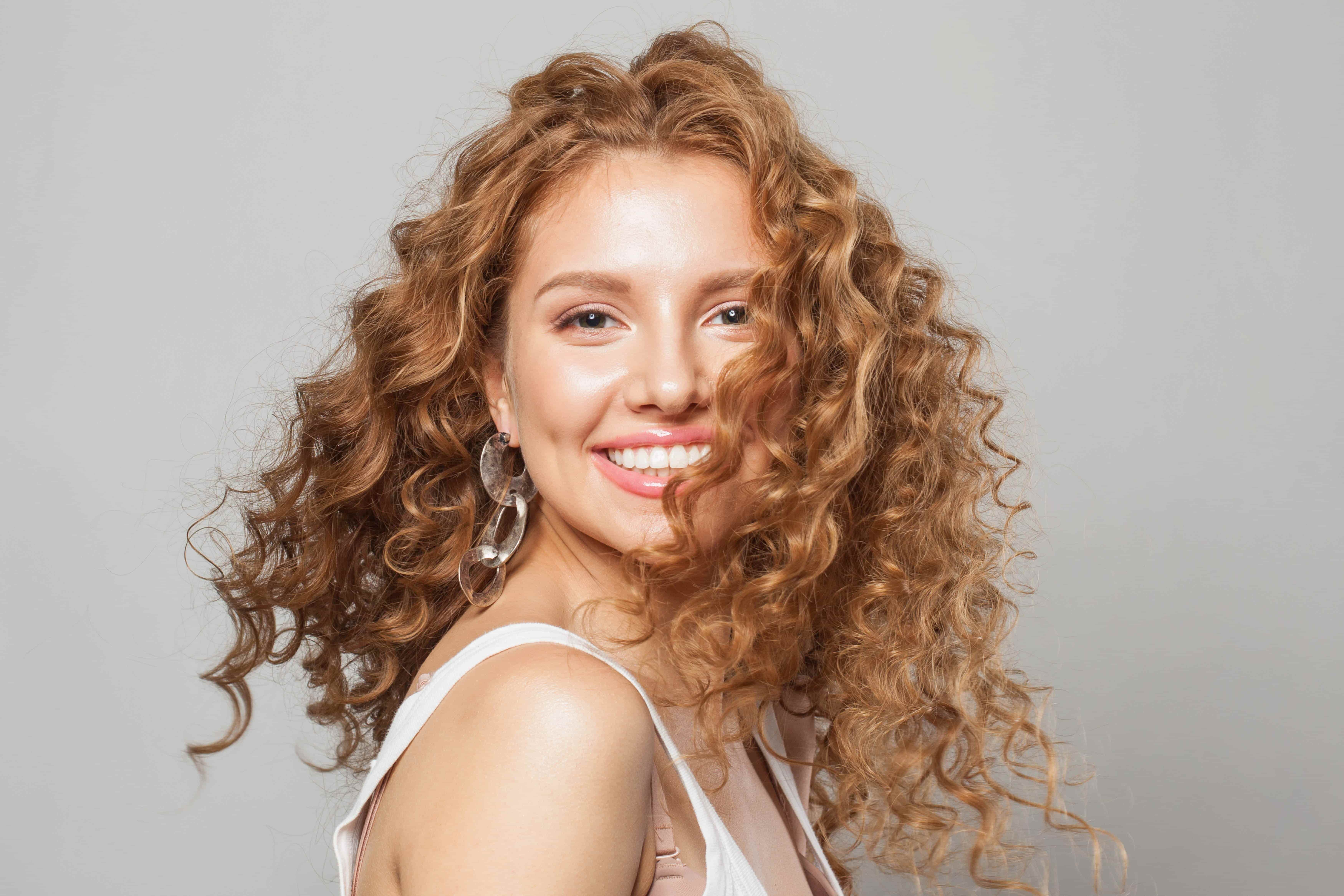 red-haired woman with curly hair