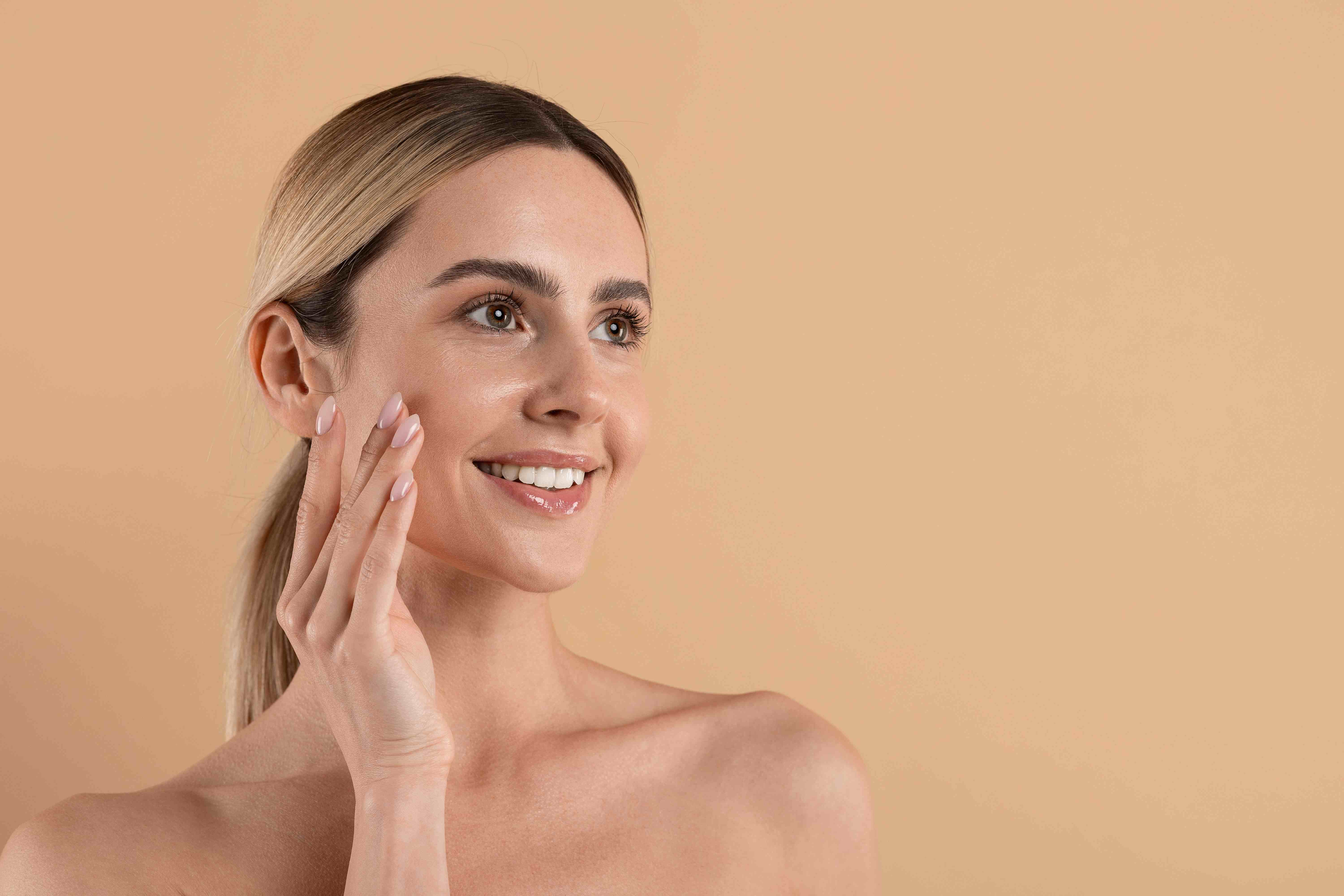 woman with beautiful skin cleaning her skin
