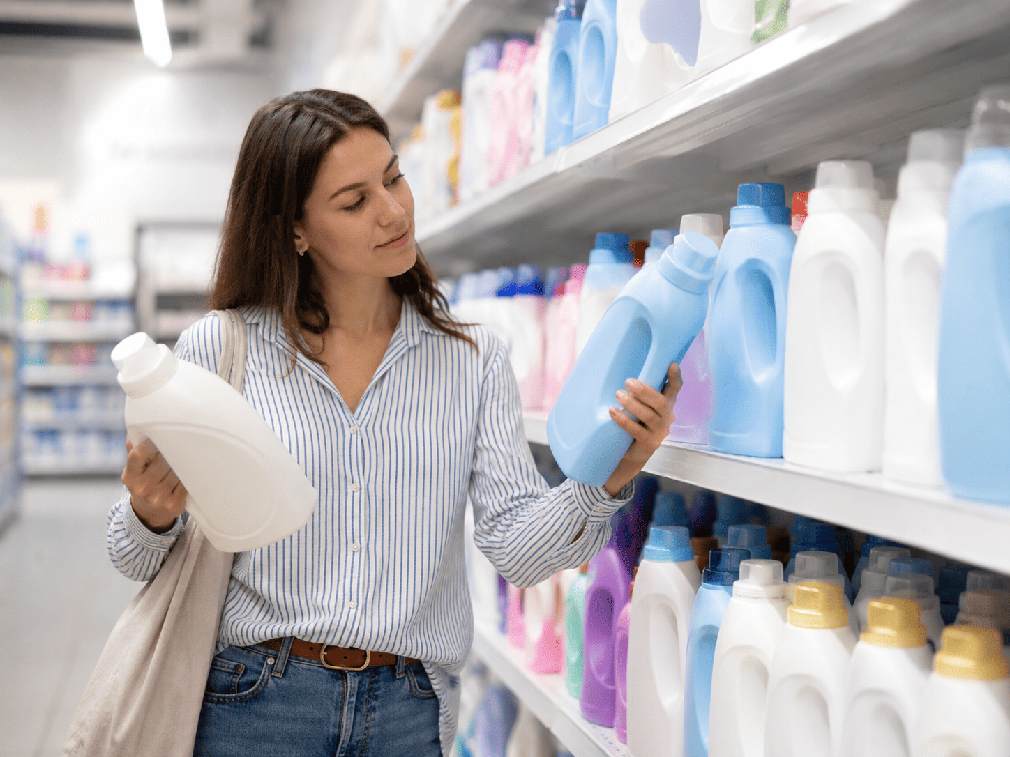 woman choosing laundry detergent